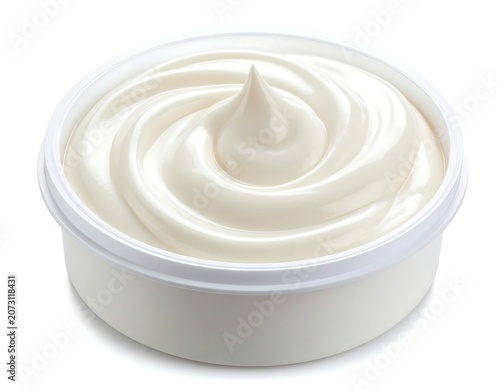 A close-up of a small, round, white plastic container filled with a swirled creamy white dip