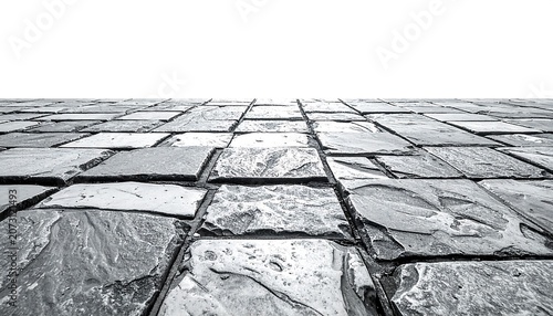 A close-up of a stone floor with square tiles
