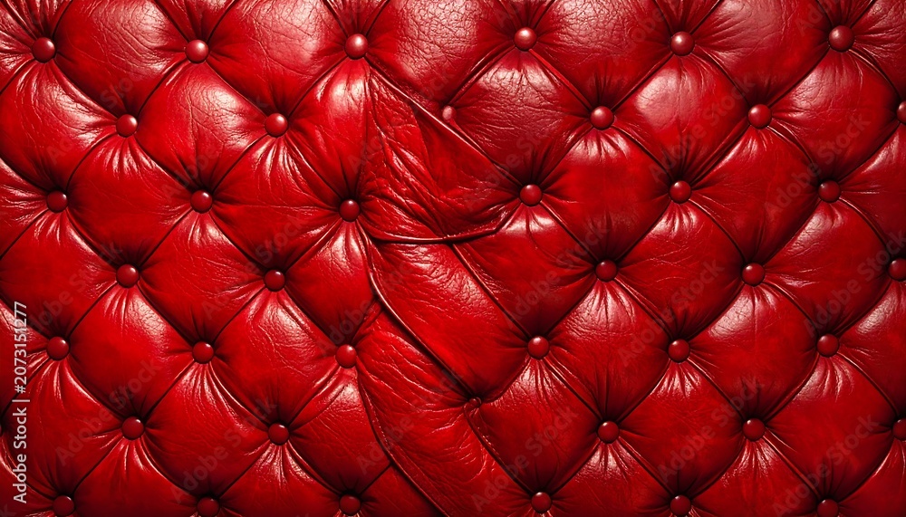 Fototapeta premium Close-up of richly textured, tufted red leather upholstery