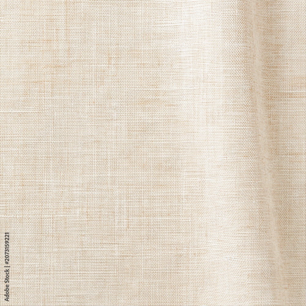 Fototapeta premium Fabric texture shows light cream color and natural weave patterns in a close-up view for textile design or fashion projects