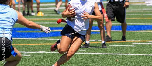 Flag Football Players Compete on a Field During a Game Day Event