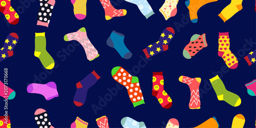Seamless pattern featuring colorful socks scattered on a dark background. Fun textile design suitable for fabric printing, wrapping paper, apparel, packaging, stationery and home decor projects.