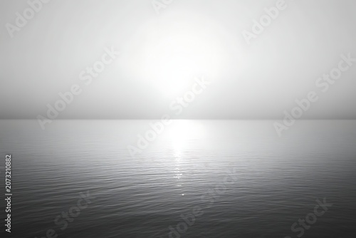 Minimalist black and white seascape with sun reflecting on calm water