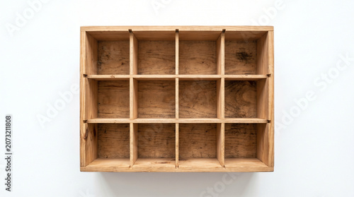 Top View of an Empty Wooden Box with Twelve Small Storage Compartments on White Background