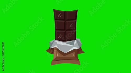 A chocolate bar partially unwrapped on a green background
