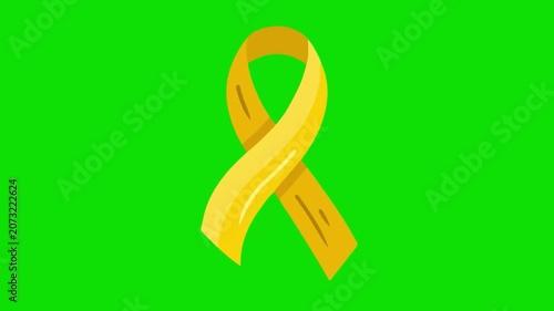 A yellow ribbon is tied in a loop on a green background.