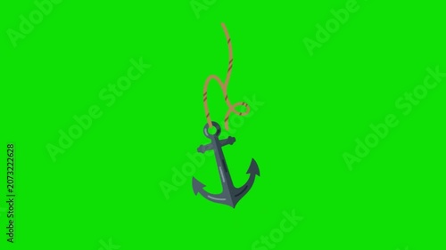 A rusty anchor hangs from a rope on a green screen background.