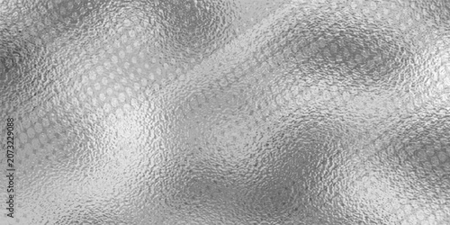 Fotografija Shiny silver foil metallic texture - glossy gray steel gleaming surface, frosted glass effect with blur glare reflection, bright polished metal material