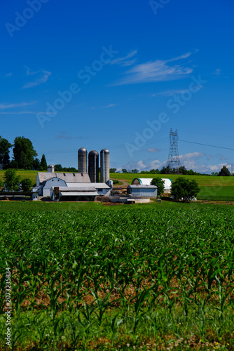 Farm landscape with buildings and fields in rural Lancaster County during the day
