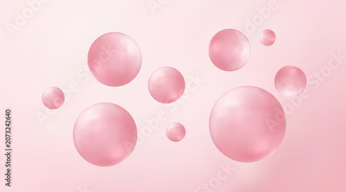 Pink bubbles floating on a gradient pink background