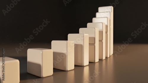 Domino blocks arranged in a rising staircase pattern symbolize strategic growth, business progress, and the potential for a successful chain reaction in a professional environment.