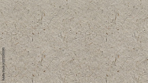 Textured light brown recycled paper surface with recycled background material