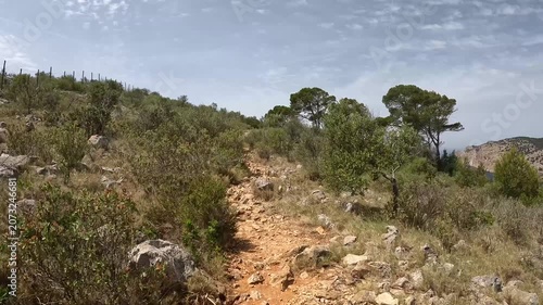 POV Uphill Hike on a Rocky Coastal Trail Through Mediterranean Scrub, Mallorca, Spain