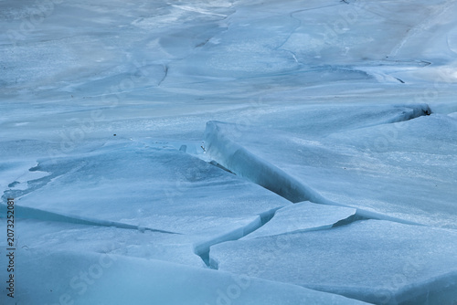 Bild auf Leinwand The abstract background of ice structure in a river landscape