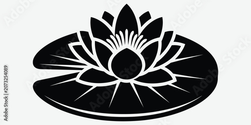 Lotus flower silhouette on a lily pad during a peaceful meditation in stark contrast
