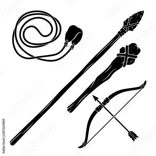 Photos Stone age and primitive weapons collection with sling spear club and bow