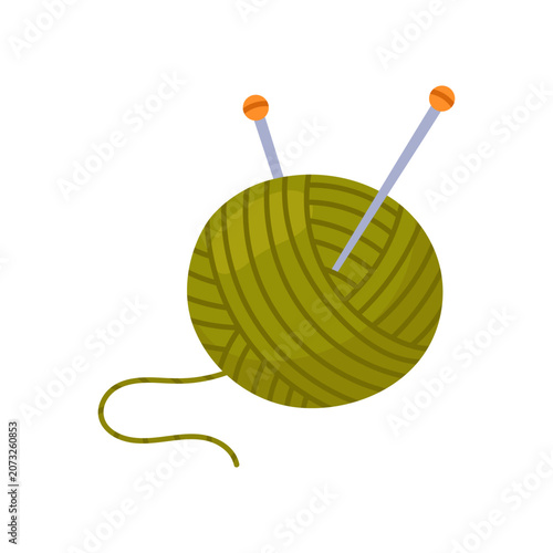 Fotografía A round skein of green yarn with metal knitting needles
