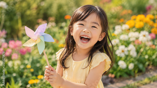 A joyful child in a flower garden, holding a colorful pinwheel and smiling brightly, surrounded by vibrant blooms.