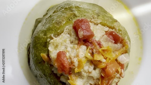 Zucchini stuffed with meat and rice, stewed in tomato sauce. Delicious and healthy home cooking.