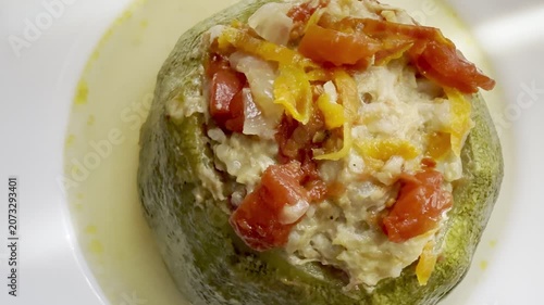Zucchini stuffed with meat and rice, stewed in tomato sauce. Delicious and healthy home cooking.