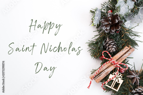 Festive Christmas wreath adorned with pine cones, cinnamon sticks, and decorative elements, conveying warmth and joy for the holiday season and New Year celebrations