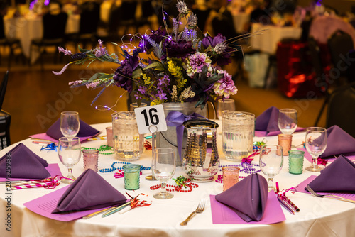 Elegant Purple Floral Centerpiece on Decorated Banquet Table at Formal Event
