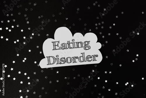 Eating Disorder Text on Black Background with Stars