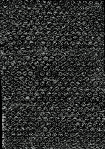 Clear plastic bubble wrap texture on black background
