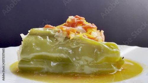 Bell peppers stuffed with meat and rice, stewed in tomato sauce. Delicious and healthy home cooking.