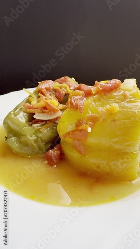 Bell peppers stuffed with meat and rice, stewed in tomato sauce. Delicious and healthy home cooking.