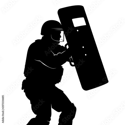 Riot police officer with shield protection.