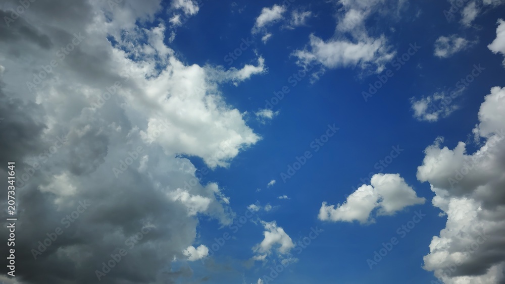 Fototapeta premium Dark storm clouds in dramatic blue sky before rain