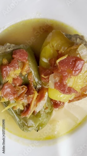 Bell peppers stuffed with meat and rice, stewed in tomato sauce. Delicious and healthy home cooking.