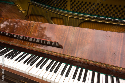 Old retro piano, musical instruments, vintage piano outdoors. Musical background.