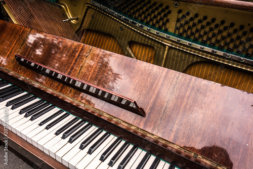 Old retro piano, musical instruments, vintage piano outdoors. Musical background.