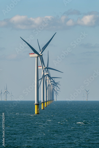 Obraz na plátne Rows of offshore wind turbines of the Burbo Bank windfarm in the Irish Sea near the UK coast between Heysham and the Isle of Man