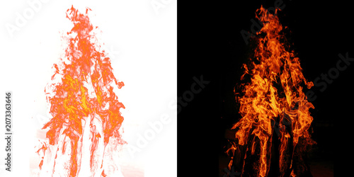 Photos A tall, vibrant bonfire burning intensely against a completely black background