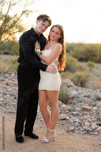 Dressed up couple in desert landscape