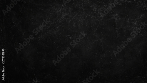 Dark scratched blackboard surface texture with cracks and scratches on wall education background