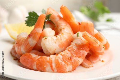 Konstfotografi Tasty boiled shrimps with parsley on table against grey background, closeup