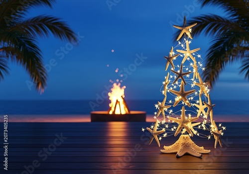 Beach holiday scene with starfish tree and evening bonfire ybhh4d6lp