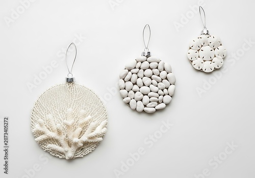 Overhead flat lay of three white textured coastal ornaments 8h0zt03w5