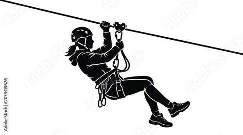 Silhouette of an active woman wearing a helmet while riding a fast steel zip line cable