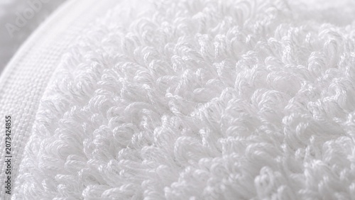Extreme macro photography filling the frame with the soft fluffy texture of a white cotton terrycloth towel