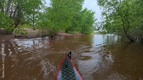 stern POV from a kayak - paddling on Horsetooth Reservoir in Fort Collins, Colorado, cloudy summer morning scenery 
