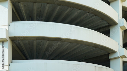 Spiral concrete ramp structure of a multi level parking garage
