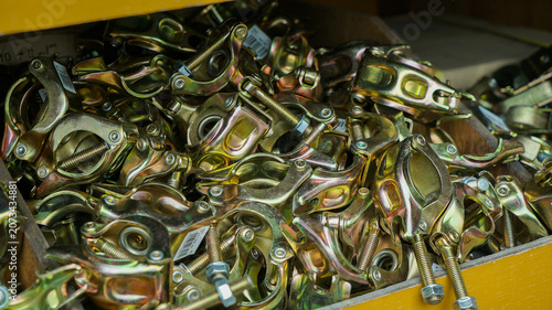 Zinc plated steel scaffolding clamps in a storage box