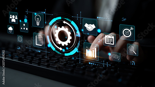 Obraz na plátně Hands on Keyboard and Digital Interface with Business Icons, Data Analysis, and Technology Representation for Modern Workplace and Innovation