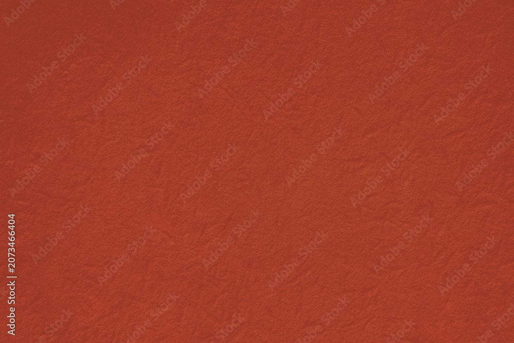 Fototapeta premium Textured red background with a subtle, fabric-like appearance.