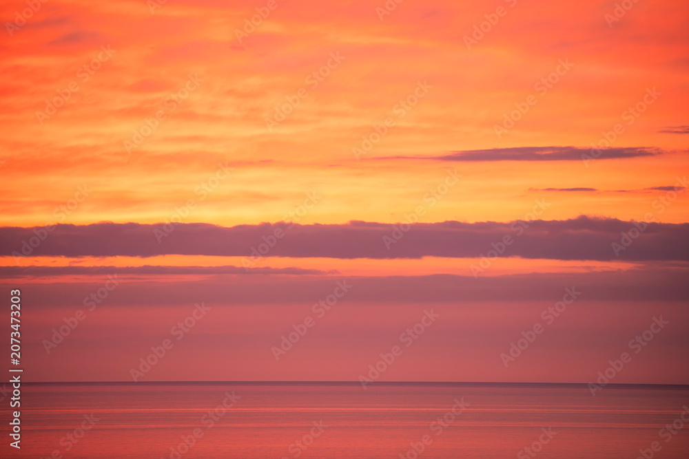Obraz premium Beautiful orange sunset over the sea. Evening sea landscape